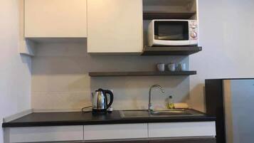 Fridge, microwave, cookware/dishes/utensils, paper towels