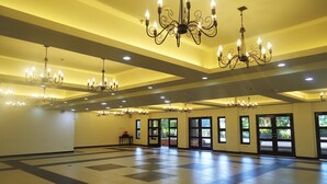 A spacious hall with multiple chandeliers and large windows. - Momarco Forest Cove Resort And Hotel (Tanay)