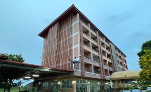 A multi-story building with a flat roof and a covered entrance area. - AK Terrace (Nong Khae)