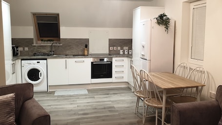 Comfort Apartment | Private kitchen | Full-size fridge, microwave, oven, stovetop