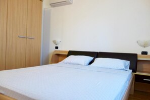 Apartment, Balcony | 2 bedrooms, desk, laptop workspace, iron/ironing board