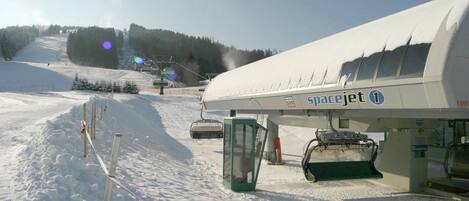 A snow-covered ski slope with a SpaceJet terminal.