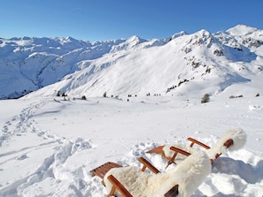 A snowy mountain landscape with a clear sky.