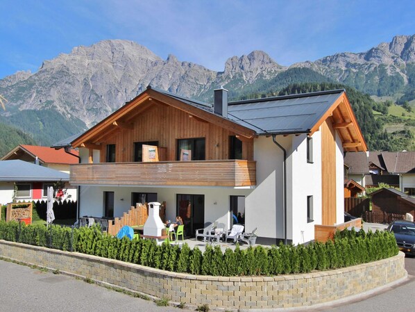 Enjoy scenic mountain views from the spacious patio area with outdoor seating.