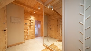 A wooden interior with a mirrored wall reflecting the room. - Zakopiana (Zakopane)