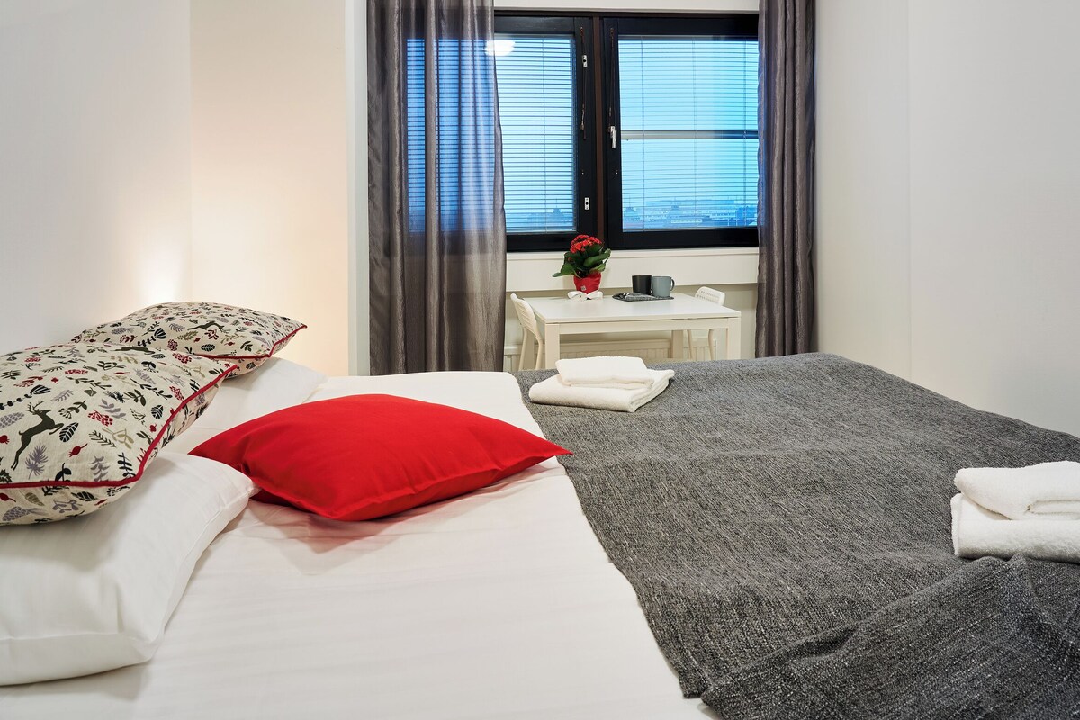 Hypo-allergenic bedding, desk, laptop workspace, blackout curtains