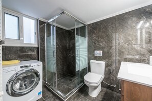 Shower, hair dryer, towels, soap