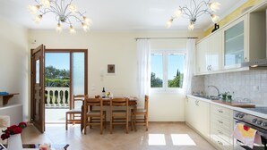 Apartment, 1 Bedroom | Living area | Flat-screen TV - Karitas Place (Corfu)