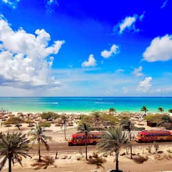 On the beach, white sand, free beach cabanas, beach umbrellas