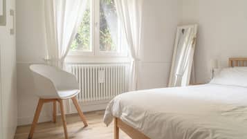 1 bedroom, desk, iron/ironing board, travel crib