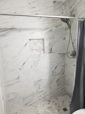 Combined shower/tub, hair dryer, towels, toilet paper