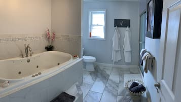 Bathtub, jetted tub, towels, soap