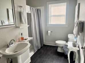 Shower, hair dryer, towels, soap