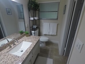 Combined shower/bathtub, hair dryer, towels, soap