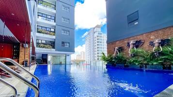 Outdoor pool, open 7:00 AM to 7:00 PM, pool umbrellas, pool loungers