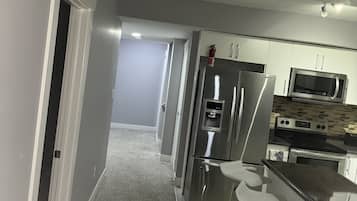 Microwave, dishwasher, coffee/tea maker, cookware/dishes/utensils