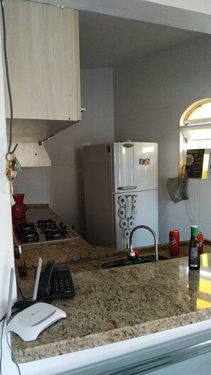 Fridge, microwave, stovetop, coffee/tea maker