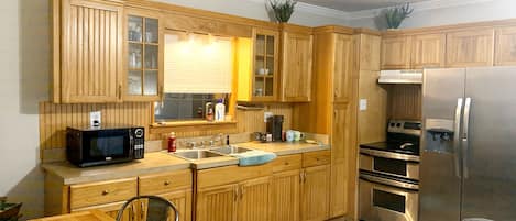 Fridge, microwave, stovetop, coffee/tea maker