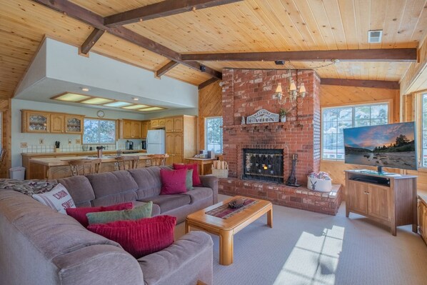 Flat-screen TV, fireplace, table football