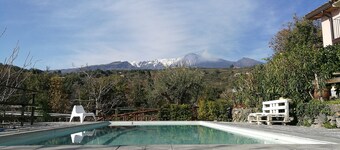 House surrounded by greenery surrounded by olive trees lemons chestnut grove and vineyard