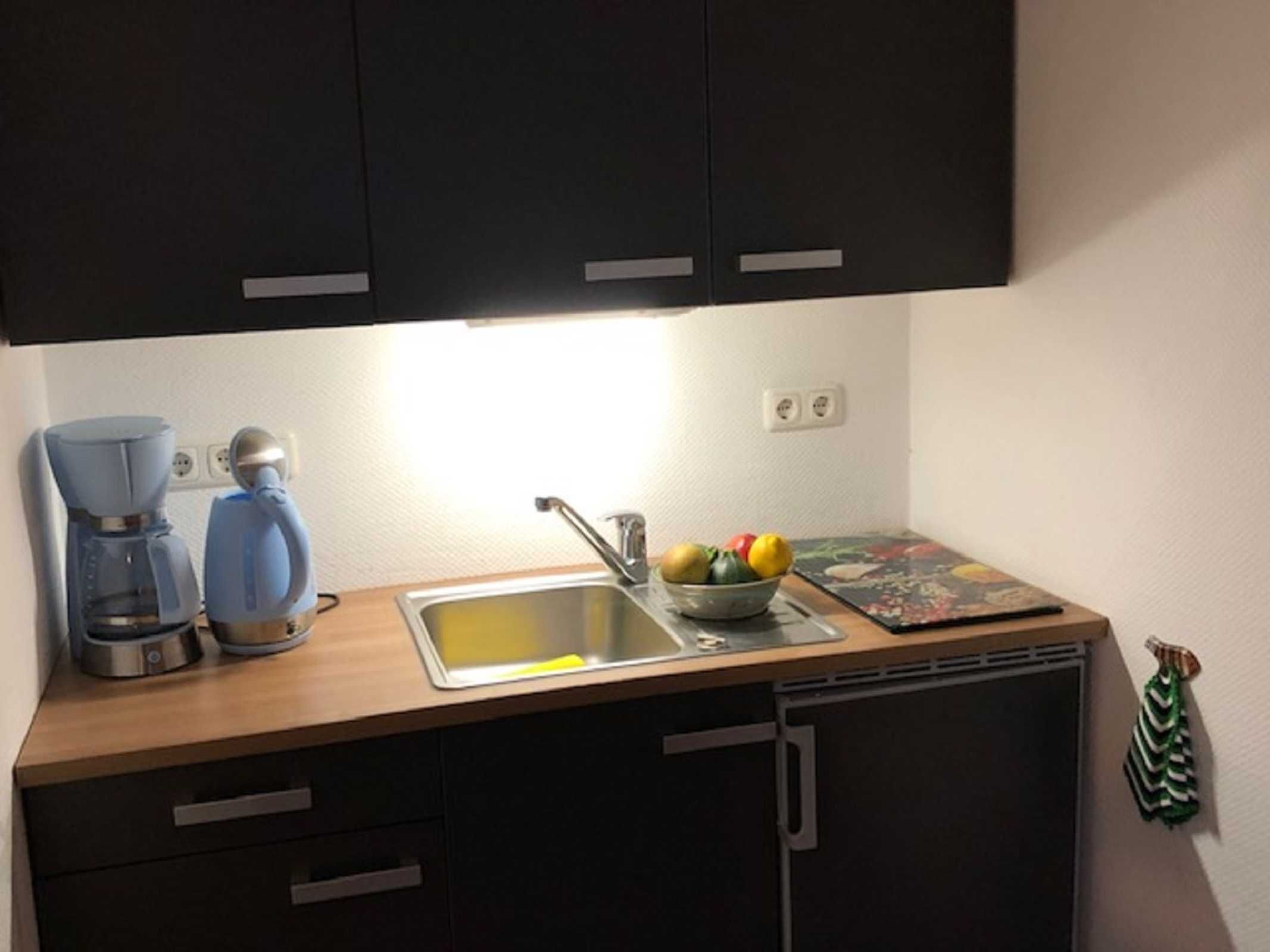 Fridge, coffee/tea maker, electric kettle, toaster