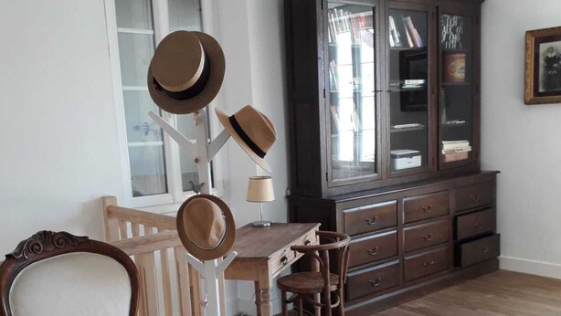 A room with a wooden chair, a wooden desk, and a cabinet with glass doors. - COMPLETE AUTHENTIC QUIET & HEALTHY HOUSE WITH PICINE 10x4m = 100% YOURS (Saint-Martial)