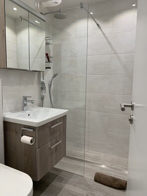 Bathtub, hair dryer, towels, soap