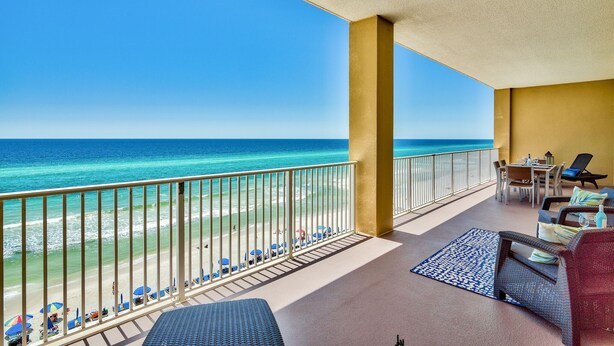A balcony with a view of the beach and ocean. - 3 BR, 3 BA Gulf-front condo. 2 Masters on HUGE balcony, Free Beach Chairs! (Panama City Beach)