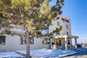 A modern hotel building with a sign reading "my hotel" on the facade. - My Hotel Karakol (Karakol)