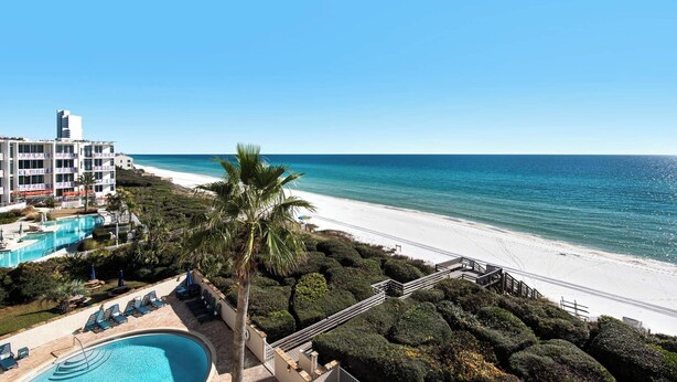 A resort with a swimming pool, beach access, and a view of the ocean. - Gulf-front condo, Private Beach, Pool w/ beach chairs & attraction tickets! (Santa Rosa Beach)