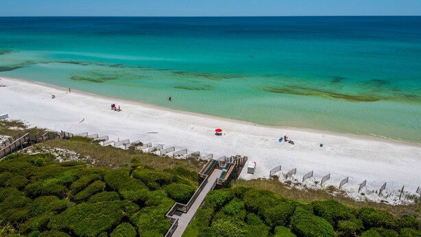 An aerial view of a beach with a wooden boardwalk leading to a white sandy shore. - Private Beach Access, Heated Pool, Beach Chairs + Free Attraction Tickets! (Santa Rosa Beach)