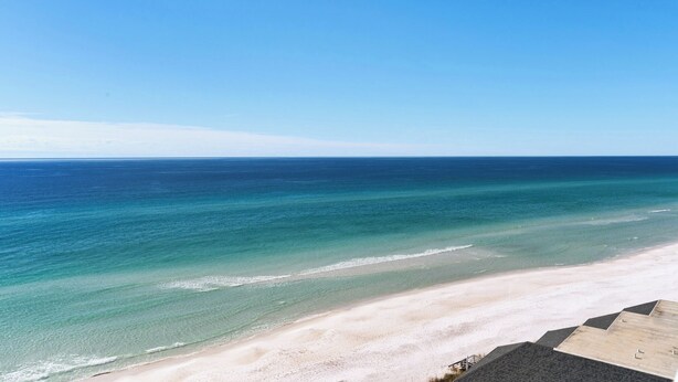 A beach with clear turquoise waters and a sandy shore. - Gulf Front, Private Beach w/ Beach Setup, Pool + Free Attraction Tickets! (Santa Rosa Beach)