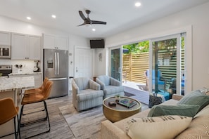 Enjoy a spacious open-plan living area with a kitchen, dining area, and living room.