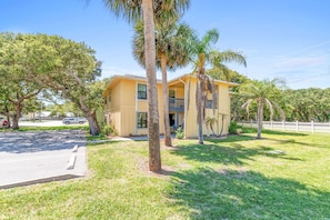 Stroll up to this charming two-story home with a welcoming front porch and beautifully manicured yard.