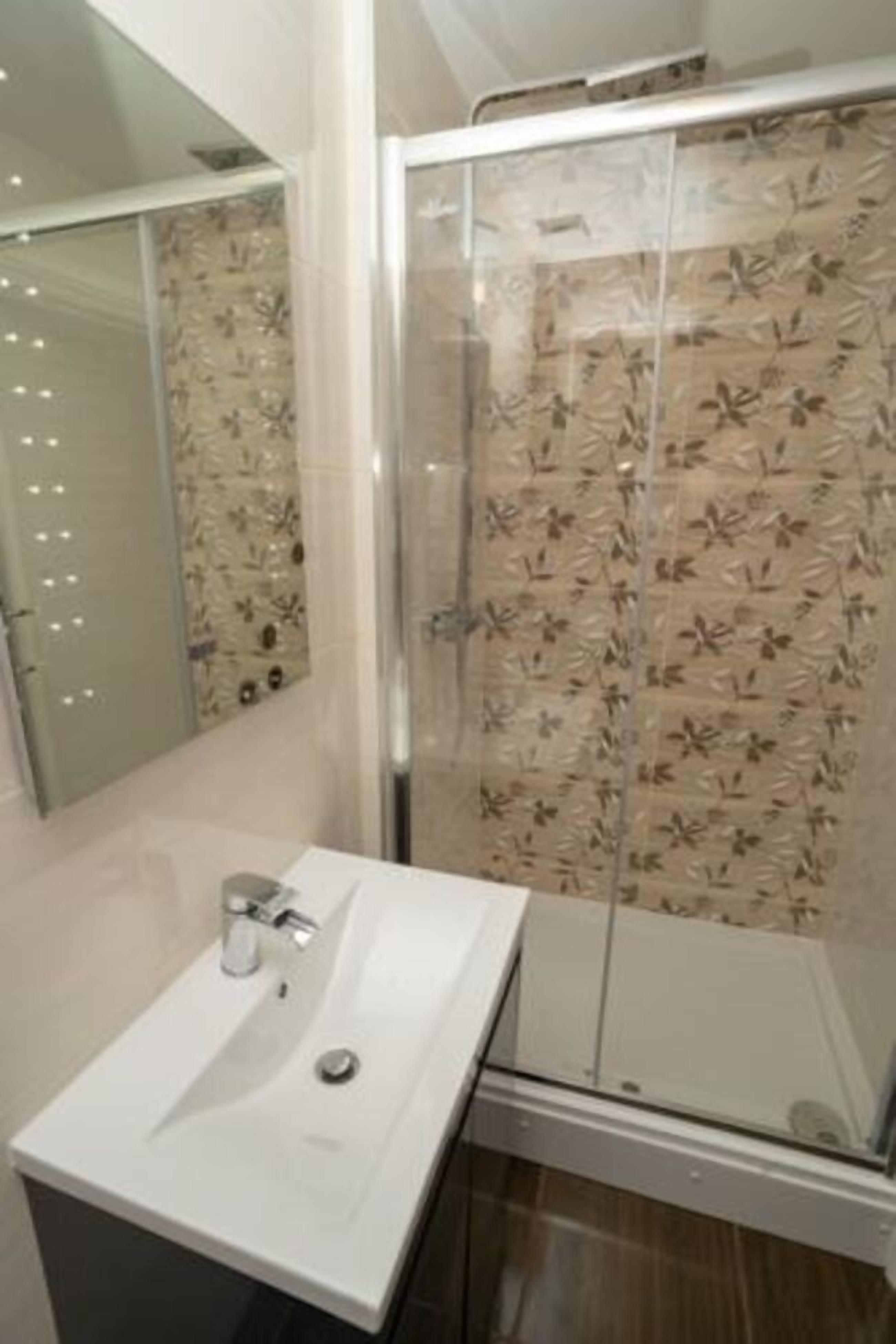 superior double room | bathroom | shower, free toiletries, hair dryer, towels