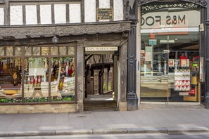 A storefront with a sign reading 'Lady Peckett's Yard' and a 'MFD 28M' sign above the entrance.