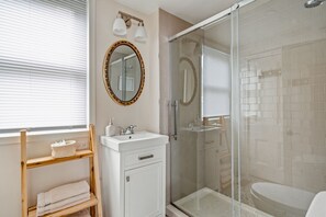 Shower, hair dryer, towels, soap