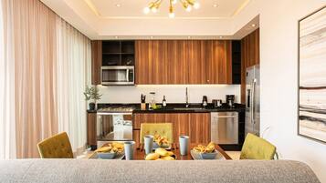Coffee/tea maker, fridge, microwave, oven
