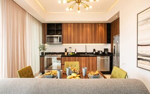 Fridge, coffee/tea maker, cookware/dishes/utensils, spices