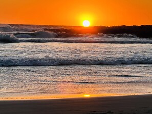 On the beach, sun loungers, beach towels
