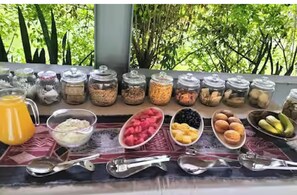 A breakfast buffet with various food items and condiments.