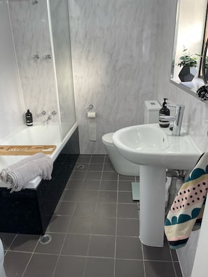 Combined shower/tub, hair dryer, towels, soap