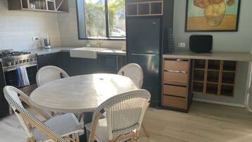Fridge, microwave, stovetop, coffee/tea maker