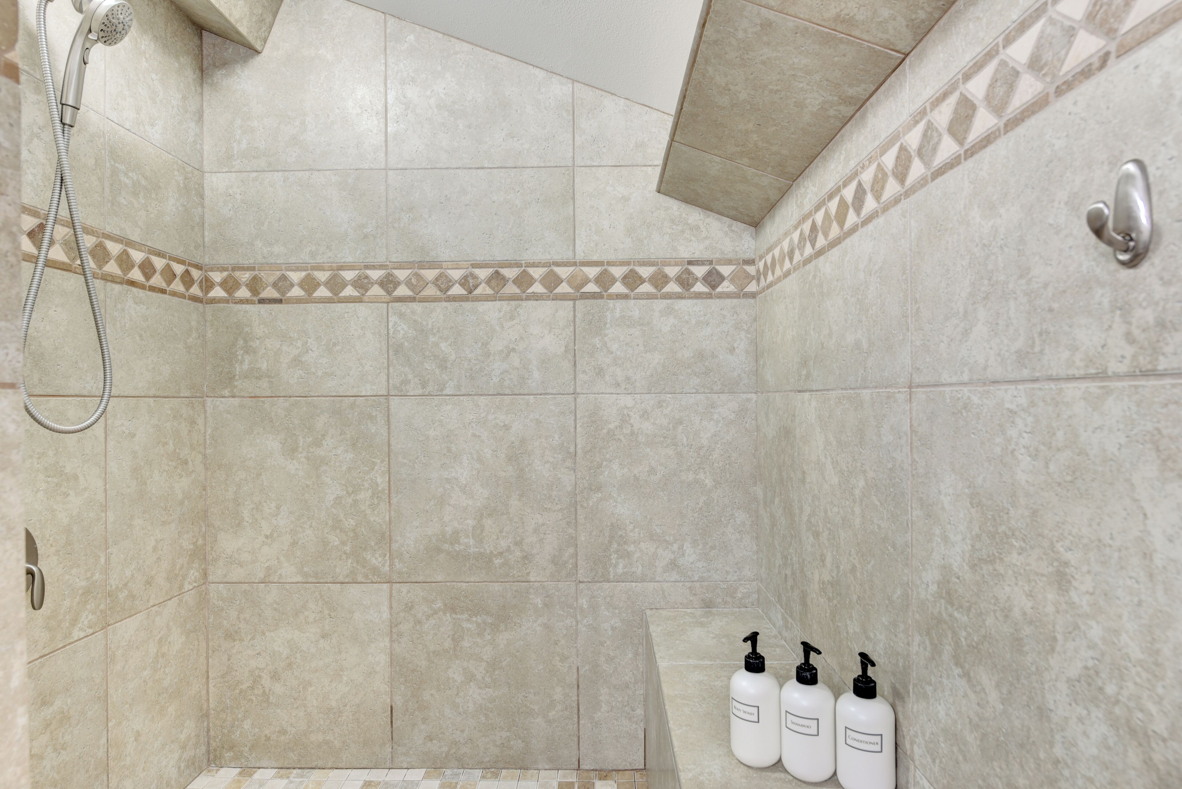 Combined shower/tub, hair dryer, towels, soap