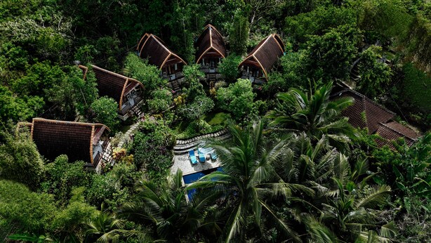A cluster of traditional-style buildings surrounded by dense tropical vegetation. - The Tukad Gepuh Cottage (Penida Island)