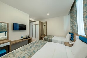 Family Room, Multiple Beds | Premium bedding, down duvets, minibar, individually decorated