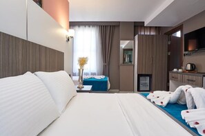 Superior Quadruple Room | Premium bedding, minibar, in-room safe, individually decorated