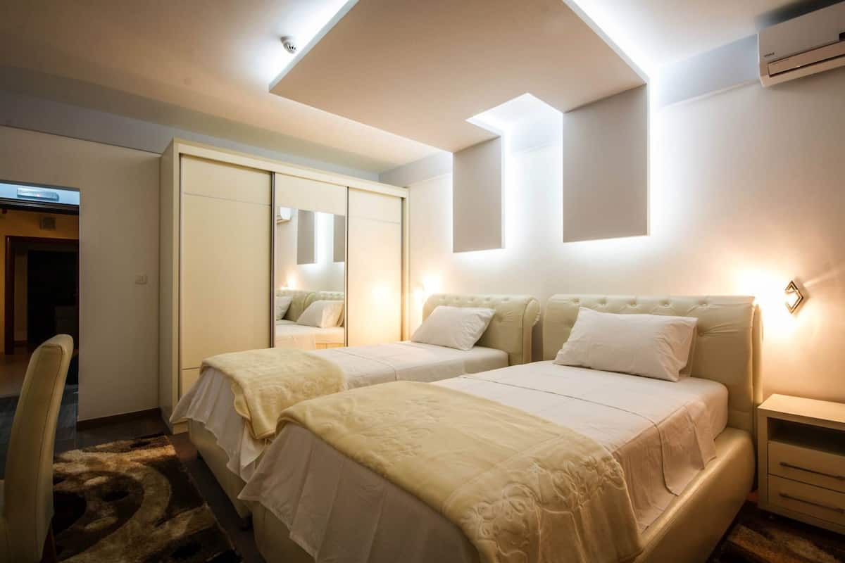 twin room | minibar, in-room safe, desk, laptop workspace