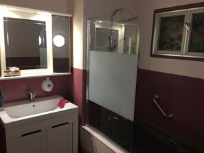 Bathtub, hair dryer, towels, soap