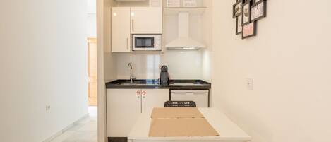 Fridge, microwave, stovetop, coffee/tea maker